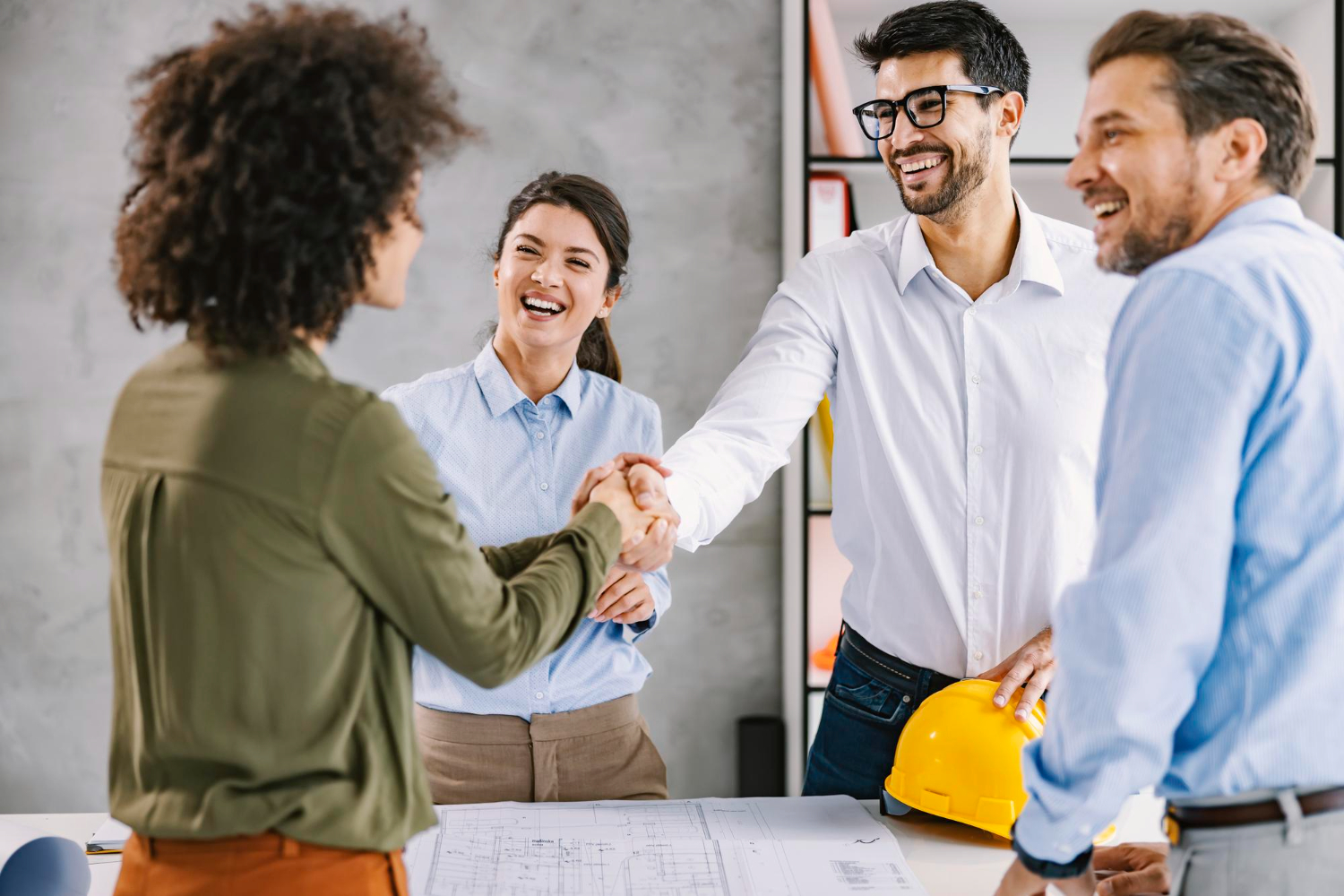 multicultural-architects-introducing-shaking-hands-office