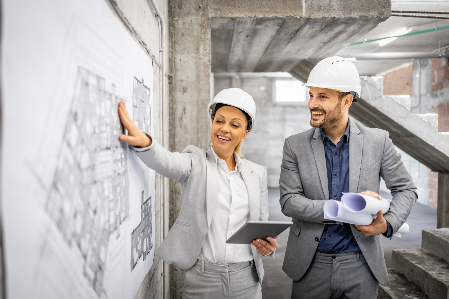 structural-engineers-with-project-plan-computer-controlling-inspecting-building-process